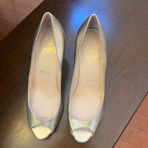 Low wedge gold Louboutin sandal